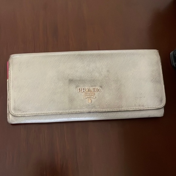 Cream colored Prada wallet. In used condition. - Picture 1 of 4